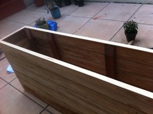 an assembled redwood planter box