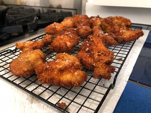 fried chicken on a cooling rack