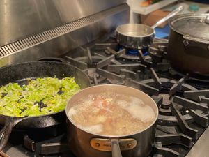 Leeks, potatoes and garlic all cooking