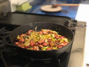 Meat cooking in a cast iron skillet