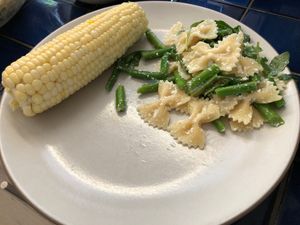 pasta with asparagus, corn on a plate