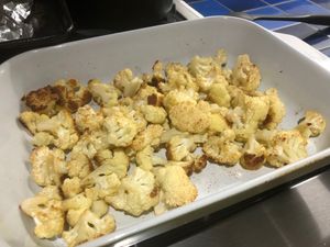 cooked cauliflower on a roasting pan