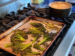 Brocolli and green garlic on a sheet pan