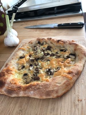 Mushroom pizza on a cutting board