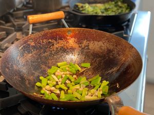 Green garlic and onions in a wok