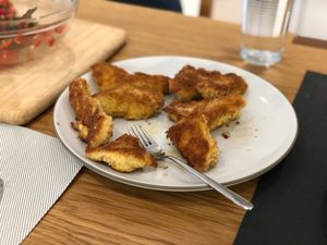 a plate with breaded &amp; fried fish