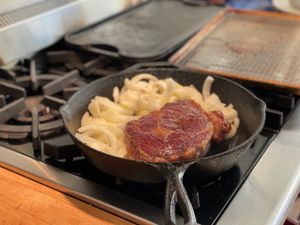 Steak and onions in the pan