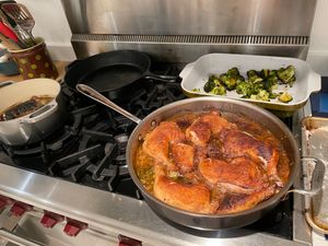 Braised chicken legs cooking on the stove