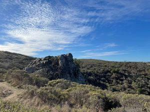 Boulder in front of blue skies