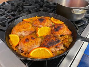 Chicken cooking in a skillet