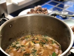 Stew with beef in the background