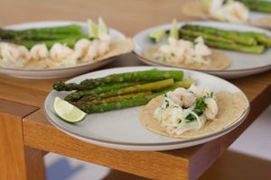 Plates of shrimp tacos  asparagus